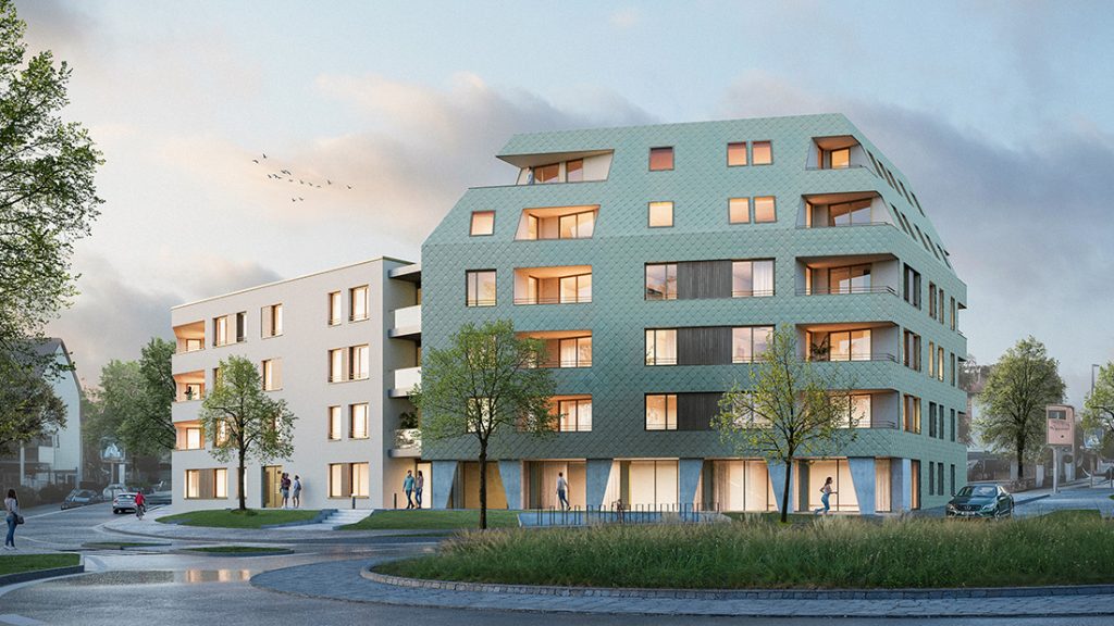 Abendliche Straßenansicht des Wohn- und Gewerbebaus Schönaich mit grüner Metallrautenfassade am Kreisverkehr der Böblinger Straße